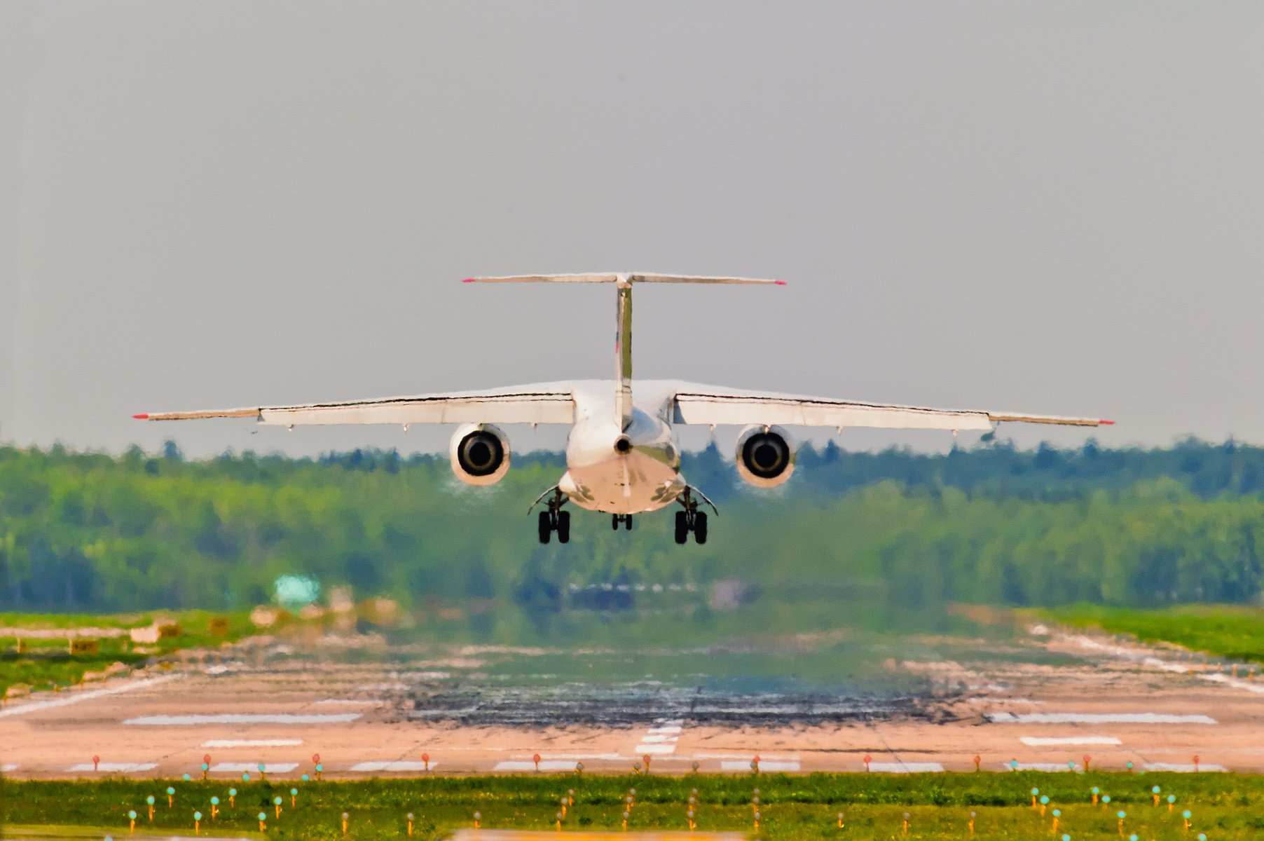 Rear view of an aircraft departing from the airport