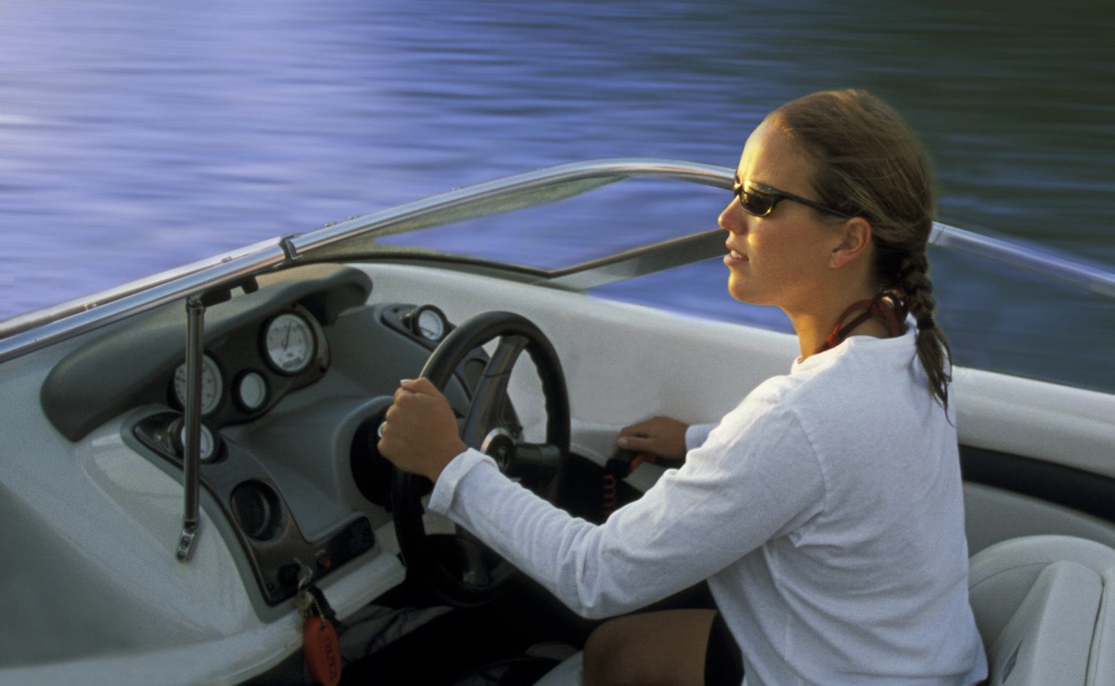 Woman Driving Speedboat