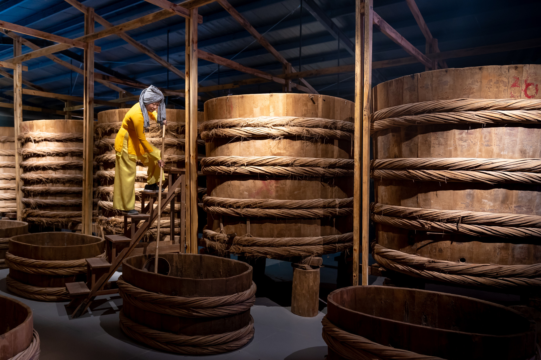 Woman in Traditional Fish Sauce Factory